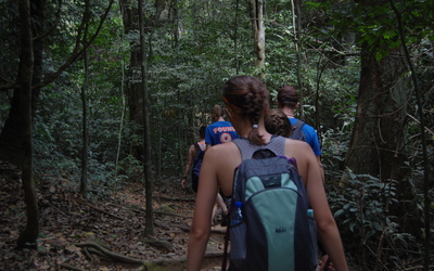 Students enjoy a hike through the dense rainforest of Kakum National Park